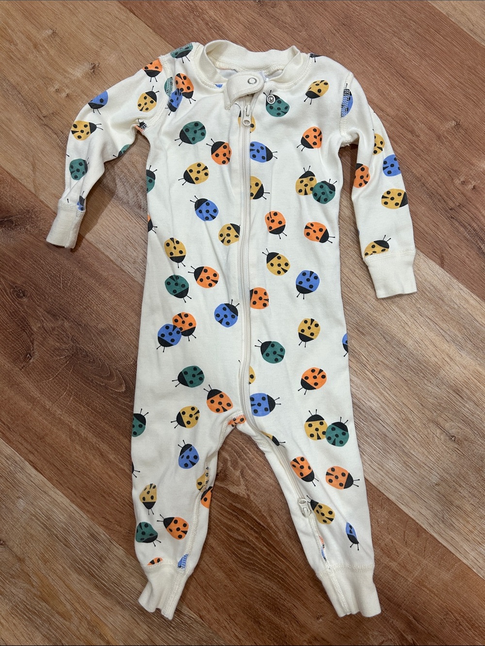 Hanna Andersson Cream Baby One-Piece Sleepsuit with Multicolor Ladybug Print